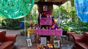 Halloween traditions around the world include this Día de Muertos ofrenda in Coyoacán with sugar skulls, marigolds and papel picado