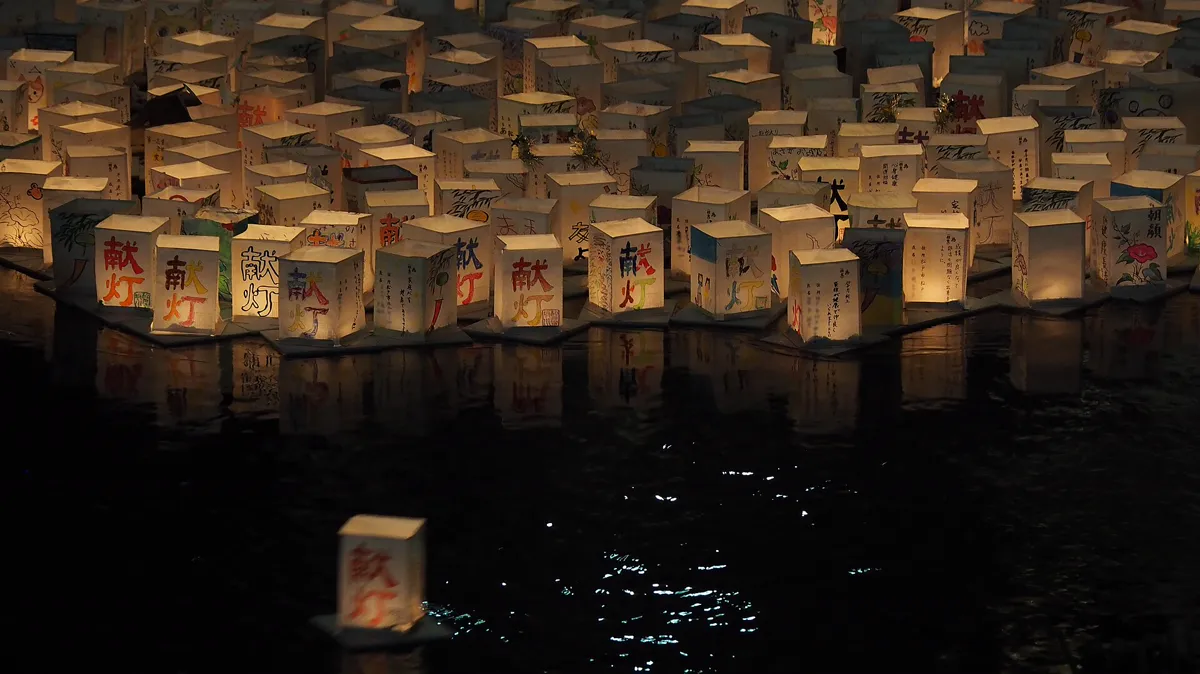 Toro nagashi water lanterns on the Saka River in Matsudo, Japan Hundreds of paper water lanterns floating on the Saka River in Matsudo, Japan, for a summer toro nagashi ceremony